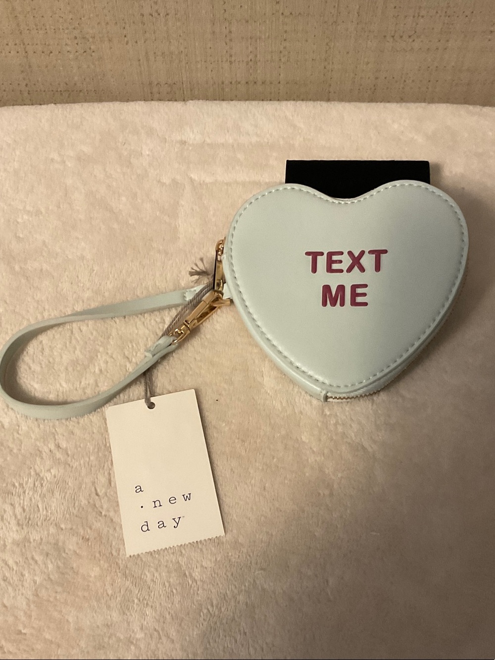 a new day Light Blue Heart Wristlet with Pink "TEXT ME" Detail